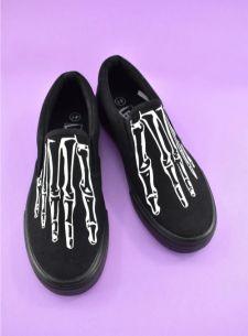 Black canvas shoes with skeleton bones illustration