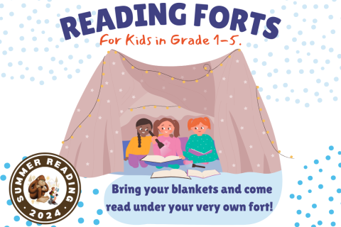 Children reading a book with a flashlight underneath a blanket fort.