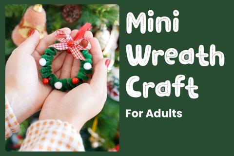 Two hands holding a mini wreath